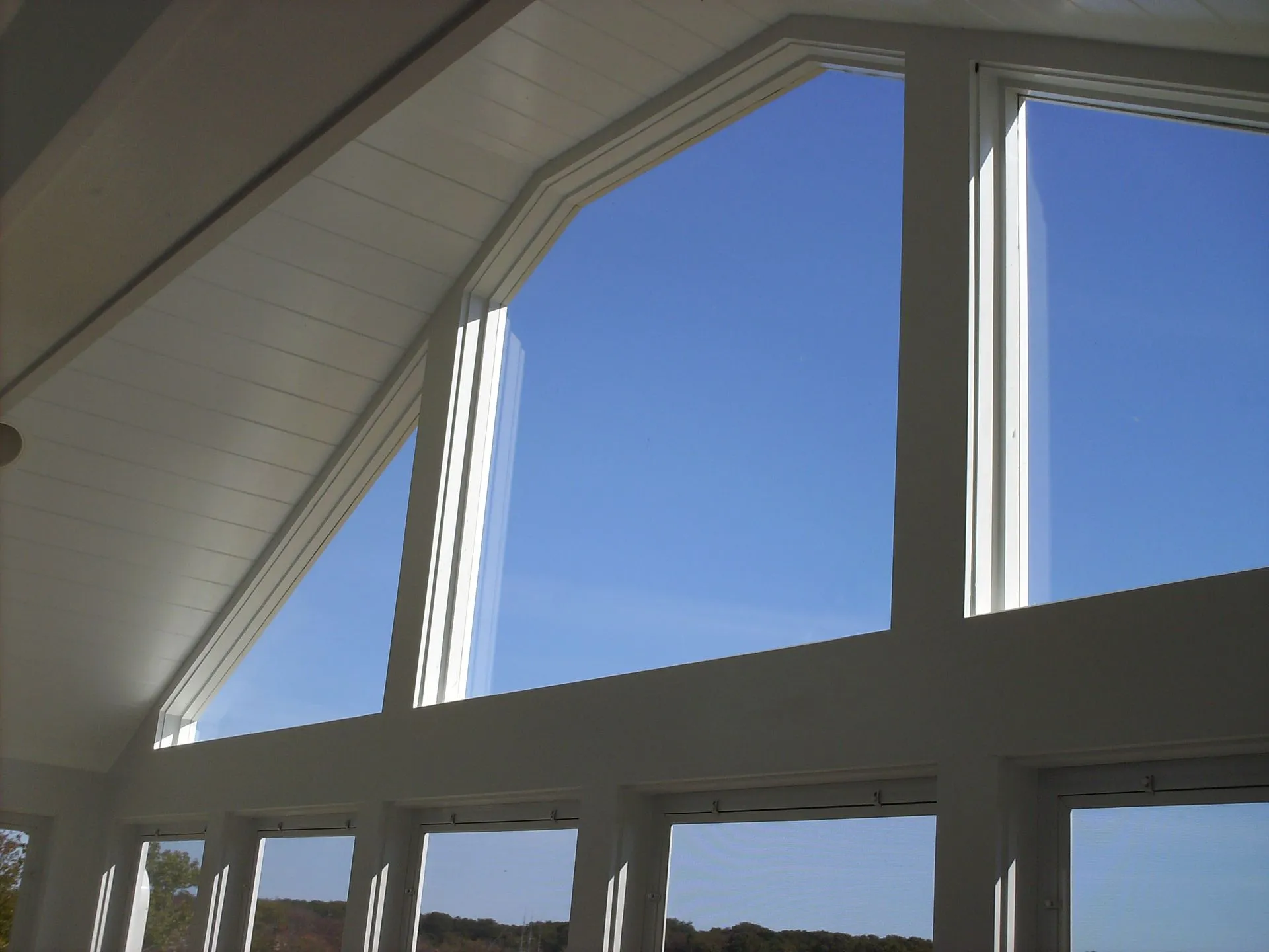 a large window with a blue sky behind it